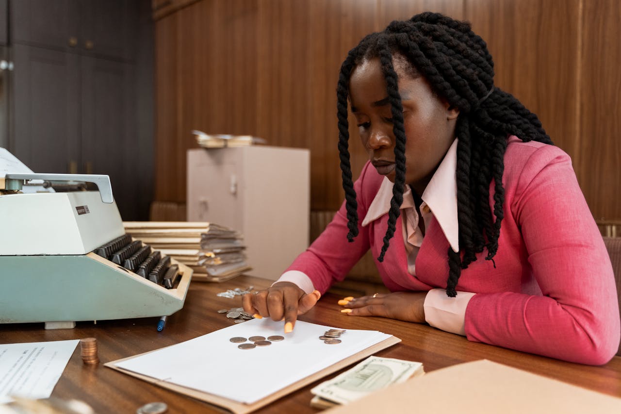 A businesswoman in vintage attire counts coins in a retro office setting.
